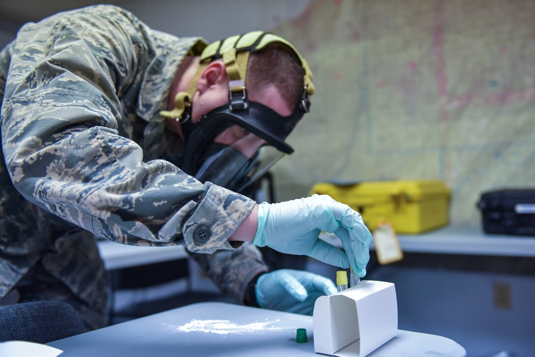 Airman Basic Jeffrey M. Guerriero, an emergency management specialist with the 911th Airlift Wing, uses a bio-check powder kit to test a powdery substance during biological response training, Coraopolis, Pennsylvania, Feb. 7, 2016. 911th Airlift Wing Reservists teamed up with their neighboring Air National Guard unit, the 171st Air Refueling Wing, to execute biological response training (U.S. Air Force photo by Staff Sgt. Jonathan Hehnly)