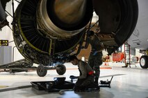 Airman Joshua Albarracin, 931st Maintenance Squadron, and Senior Airman Gregory Turner 22nd Maintenance Squadron aircraft maintainers, drain the starter on the engine of a KC-135 Stratotanker, Feb. 1, 2016, at McConnell Air Force Base, Kan. Airmen regularly perform maintenance on the KC-135 Stratotanker to ensure the aircraft continues its aerial refueling mission. (U.S. Air Force photo/Airman Jenna K. Caldwell)  