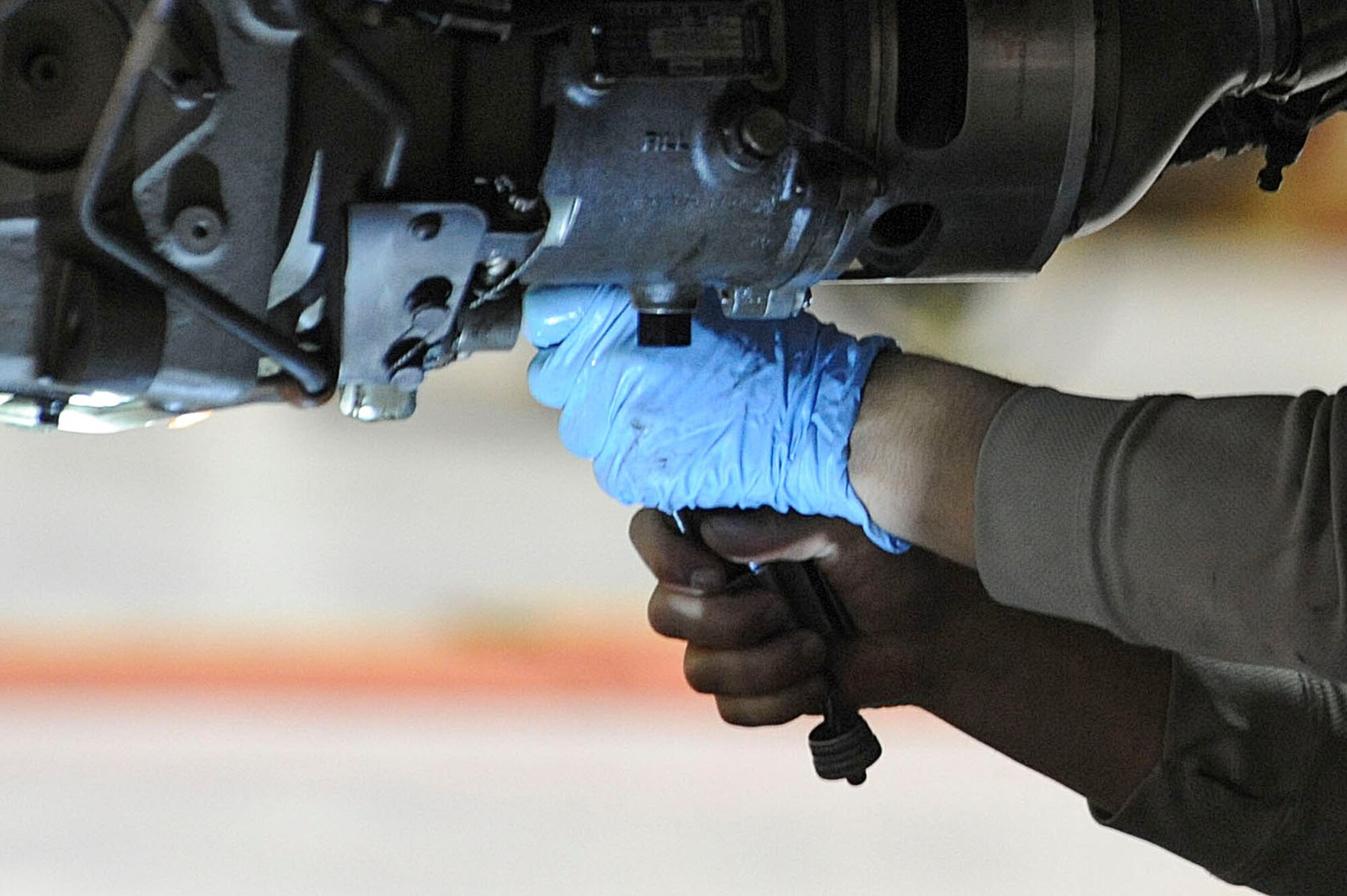 A 931st Maintenance Squadron Airman drains the starter on the engine of a KC-135 Stratotanker, Feb. 1, 2016, at McConnell Air Force Base, Kan. Maintenance Airman perform preventative inspections on the KC-135 Stratotanker fleet that are brought into the hangar for regular maintenance.  (U.S. Air Force photo/Airman Jenna K. Caldwell)  