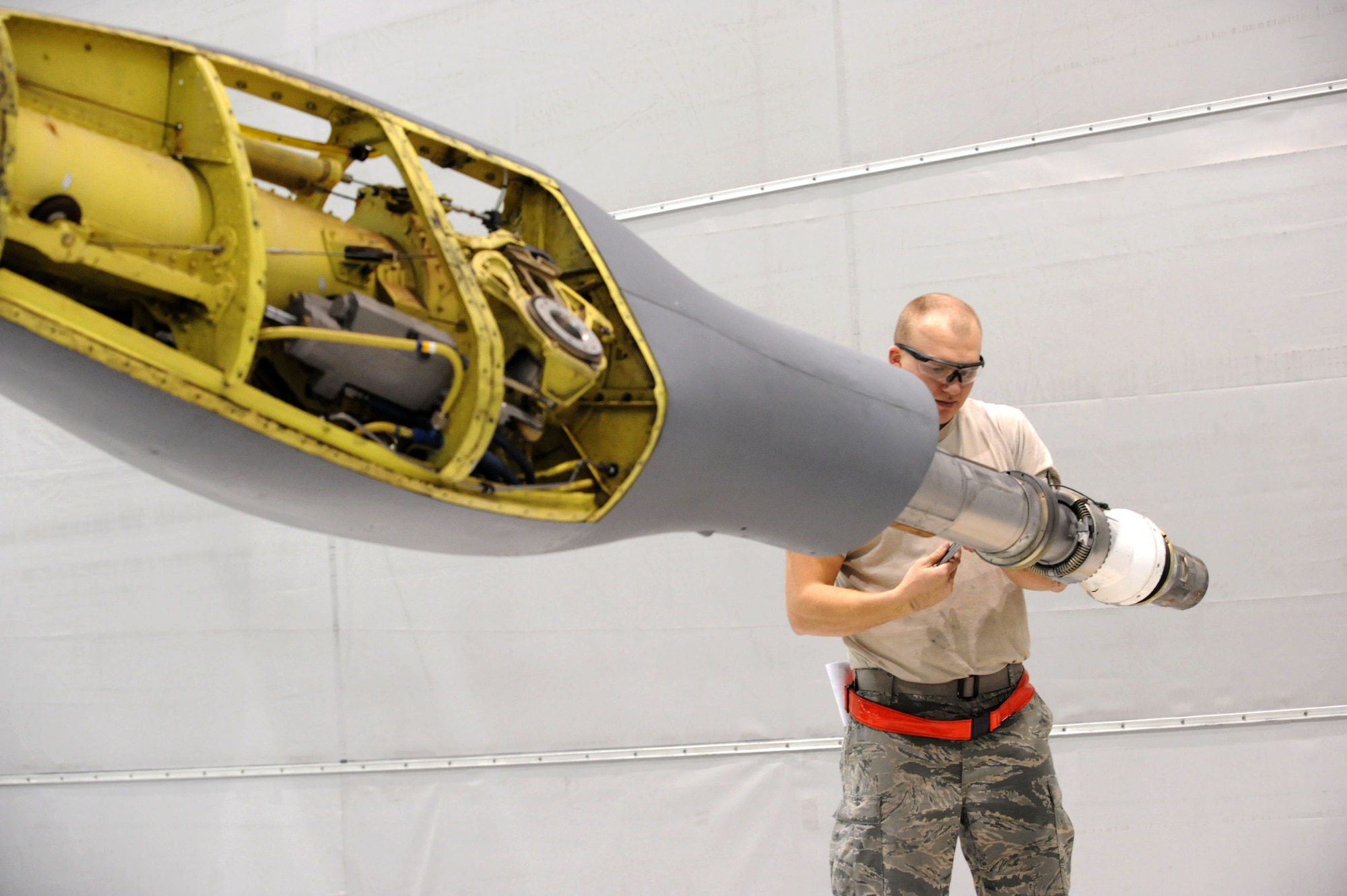 Senior Airman Tyler Schanuth 22nd Maintenance Squadron, hydraulics technician replaces bolts on the end of KC-135 Stratotanker boom, Feb. 1, 2016, at McConnell Air Force Base, Kan. Maintenance Airmen inspect the aircraft periodically to ensure the aircraft is in reliable operating condition to conduct aerial refueling missions.  (U.S. Air Force photo/Airman Jenna K. Caldwell)  