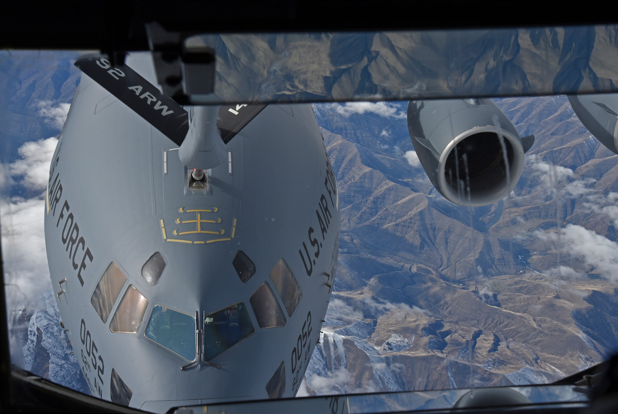 A KC-135 Stratotanker makes a connection with a C-17 Globemaster III from Joint-Base Lewis McChord, Wash., Feb. 4, 2016, over Washington State. The flight was a local training flight in which Col. Brian McDaniel, 92nd Air Refueling Wing commander, and Maj. Joshua Brown, 92nd ARS chief of squadron tactics, trained on the KC-135 Block 45 upgrade for the first time. (U.S. Air Force photo/Airman 1st Class Mackenzie Richardson)