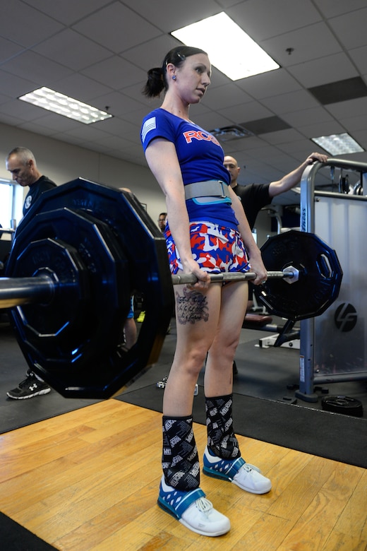 Meagan Crews, 4th Space Operations Squadron, completes a deadlift during the bench press and deadlift competition Friday, Jan. 29, 2016, in the fitness center at Schriever Air Force Base, Colorado.  Crews finished second overall in the female category with a bench press of 115 pounds and a deadlift of 215 pounds.  (U.S. Air Force photo/Christopher DeWitt)