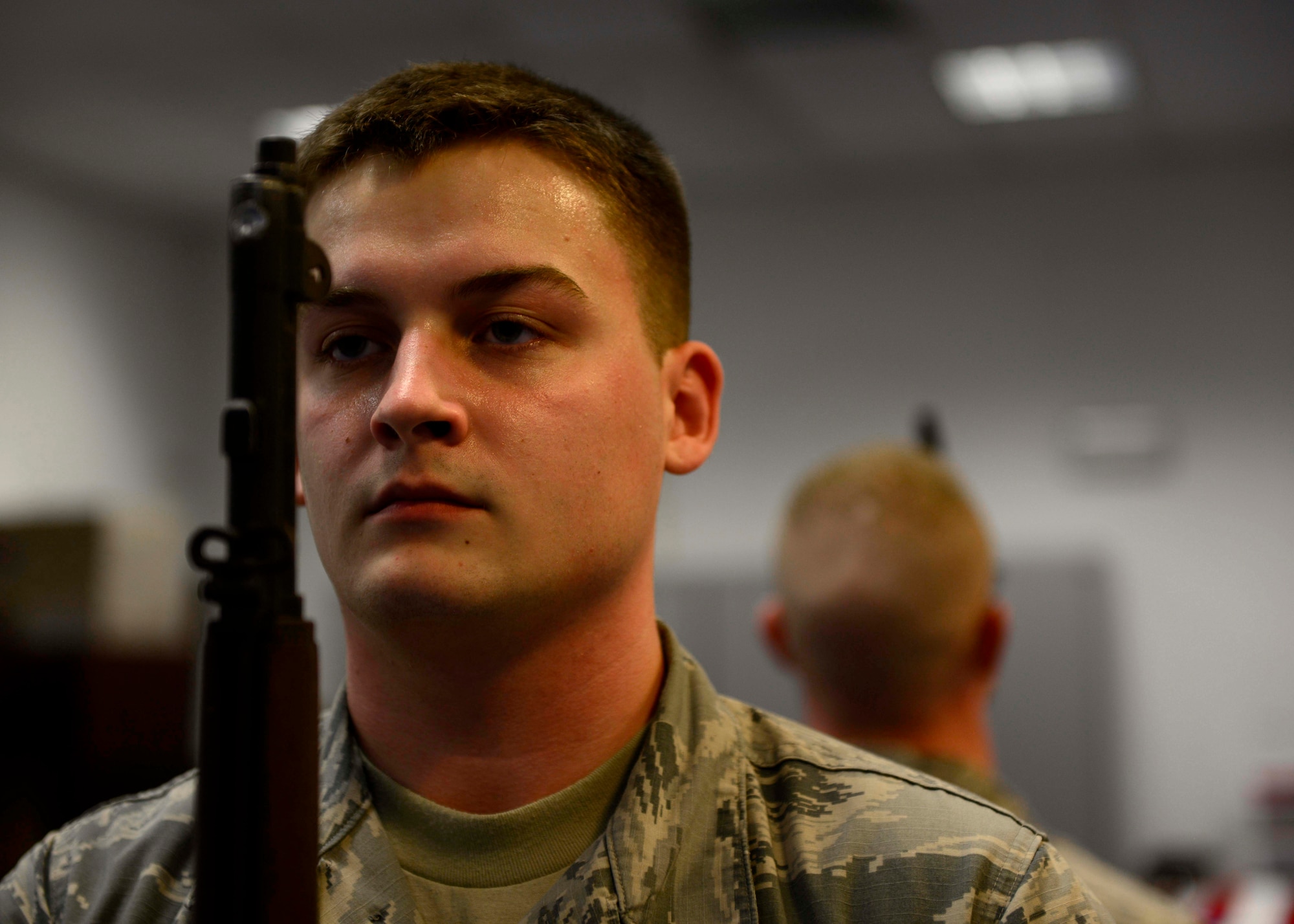 U.S. Air Force Airman 1st Class Dylan Breese, Aviano Air Base honor guardsman, rehearses drills during practice, Feb. 1, 2016, at Aviano Air Base, Italy. During their one-year voluntary commitment, Aviano honor guardsmen perform more than 70 details. (U.S. Air Force photo by Senior Airman Areca T. Bell/Released)