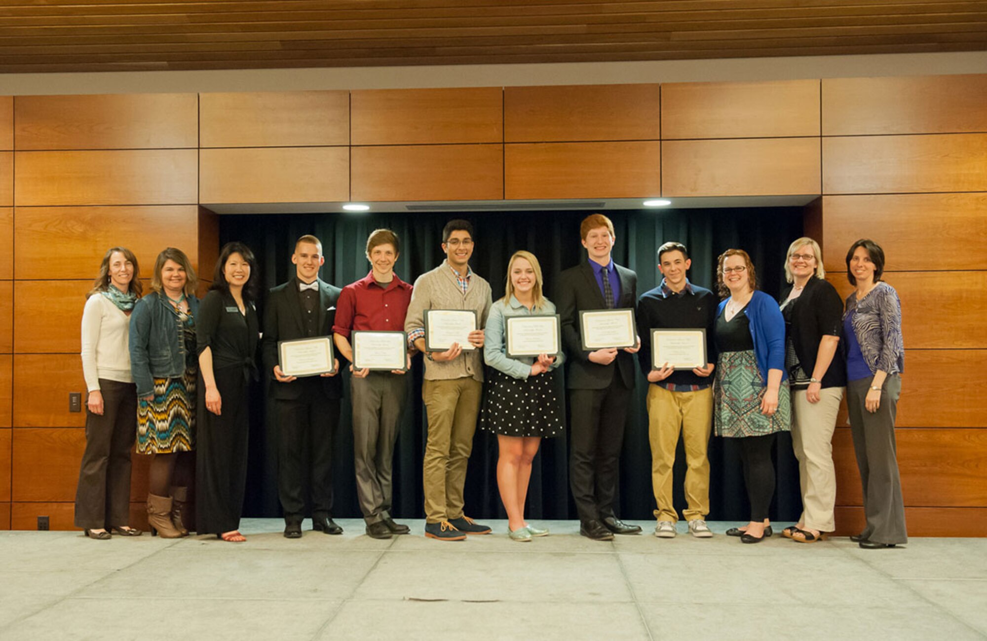 Students gather after being awarded scholarships for 2015 from the Richardson Spouses’ Club. The RSC is a private community organization dedicated to helping military members and their family. The program provides financial assistance to military dependents to further their education at an undergraduate institution. (Courtesy photo)