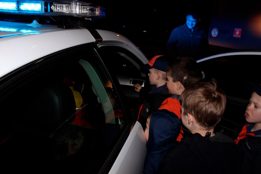 Cub Scouts look inside a patrol car from the 86th Security Forces Squadron during a visit Feb. 3, 2016, Ramstein Air Base, Germany. Airmen from the 86th SFS gave local Cub Scouts a tour of their facilities and taught them about patrol cars and how they work. (U.S. Air Force photo/Tech. Sgt. Robert A. Webb)