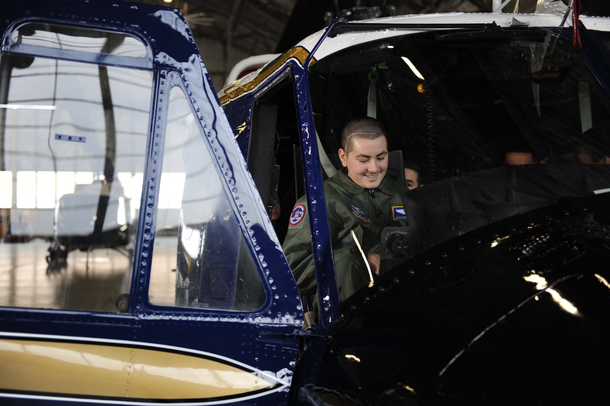 Michael Oliver, Pilot for a Day participant, sits in a UH-1N Huey helicopter at Joint Base Andrews, Md., Feb. 5, 2016. Oliver, diagnosed with Erdheim-Chester Disease, a disease with no known cure, experienced what it is like to be a pilot for a day along with friends and family. The day included touring an assortment of aircraft including an F-16 Fighting Falcon, KC-135 Stratotanker and a UH-1N Huey helicopter. (U.S. Air Force photo by Senior Airman Dylan Nuckolls/Released)