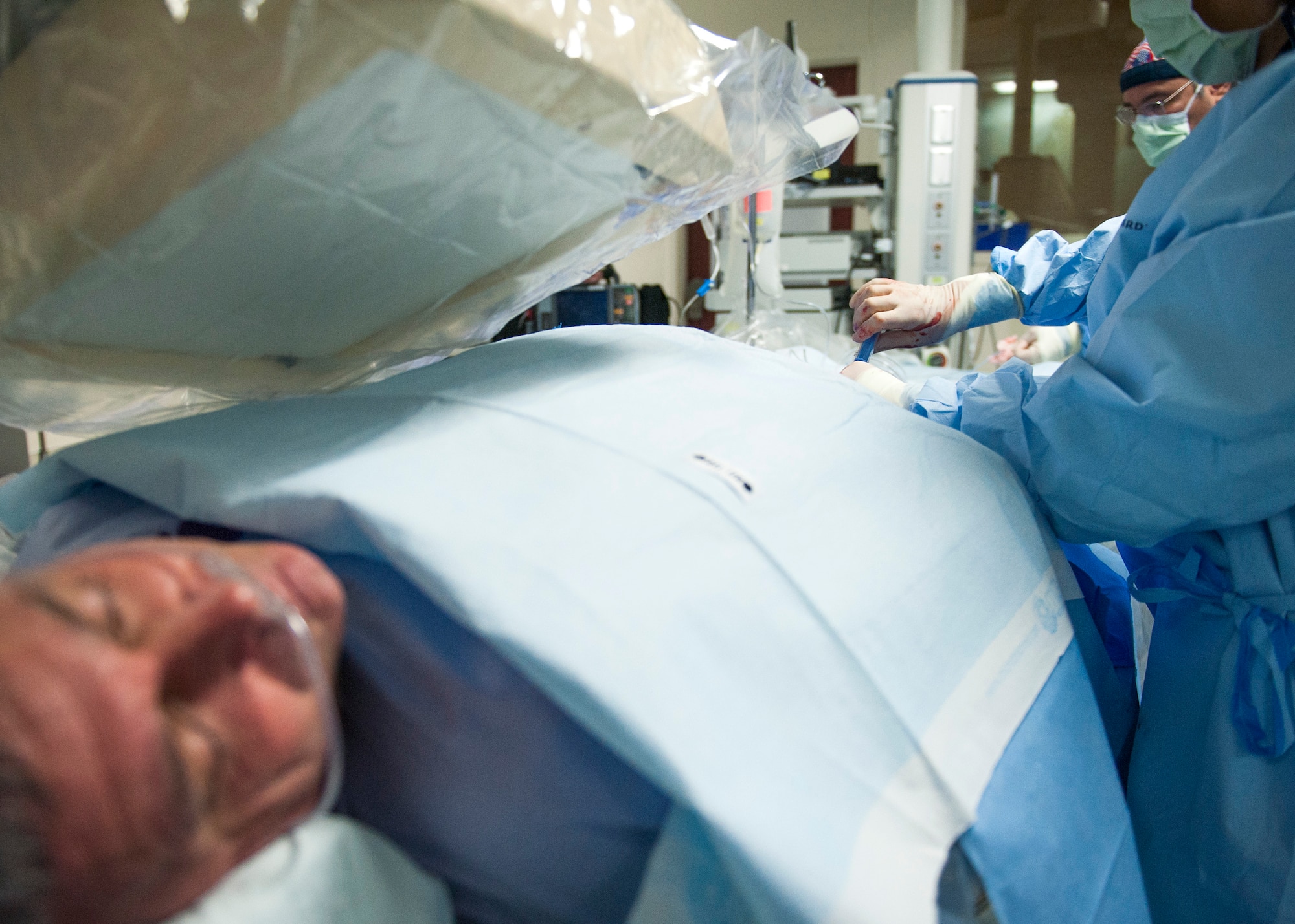 A 96th Medical Operations Squadron surgical team, performs a cardiac catheterization on a patient at Eglin Hospital Jan. 14 at Eglin Air Force Base Fla. Eglin’s newest invasive imaging procedure allows doctors to identify how well a patient’s blood flows to the artery that feeds the heart. (U.S. Air Force photo/Ilka Cole)