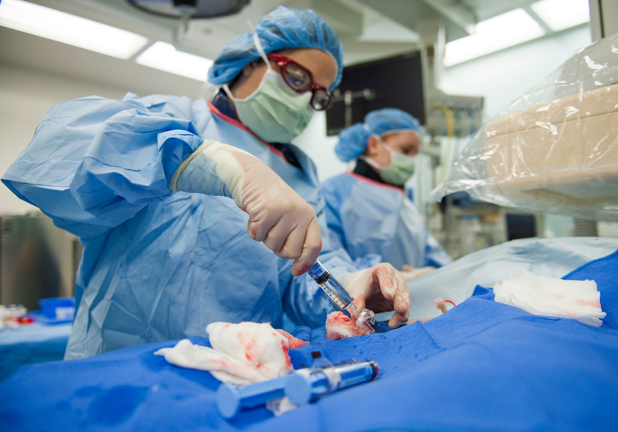 Lt. Col. (Dr.) Maria Lahti, the 96th Medical Operations Squadron’s chief cardiologist, performs a heart catheterization procedure Jan. 14 at Eglin Air Force Base, Fla. The Hospital’s newest invasive imaging procedure allows doctors to identify how well a patient’s blood flows to the artery that feeds the heart. (U.S. Air Force photo/Ilka Cole)