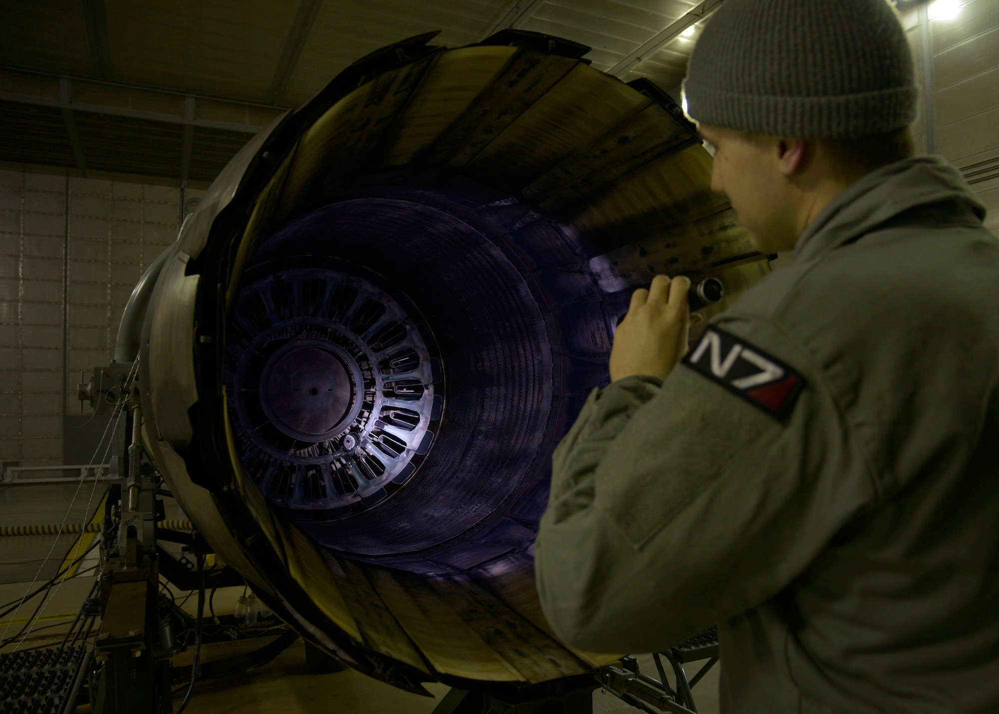 U.S. Air Force Staff Sgt. Aaron Peacock, an aerospace propulsion craftsman with the 35th Maintenance Squadron, inspects the exhaust of an F110-GE-129 engine after a test run at Misawa Air Base, Feb. 4, 2016. The most common issues that arise with F-16 Fighting Falcon engines are oil and fuel leaks or abnormal vibrations. Peacock hails from Colorado Springs, Colorado. (U.S. Air Force photo by Senior Airman Deana Heitzman)