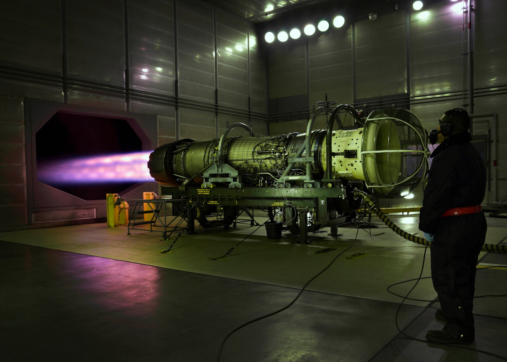 U.S. Air Force Senior Airman Daniel San Miguel, an aerospace propulsion journeyman with the 35th Maintenance Squadron, oversees an F110-GE-129 engine being tested during its afterburner phase at Misawa Air Base, Japan, Feb. 4, 2016. Each engine is tested multiple times for consistency and safety, to ensure each engine has the capability to reach peak performance. San Miguel hails from Oceanside, California. (U.S. Air Force photo by Senior Airman Deana Heitzman)