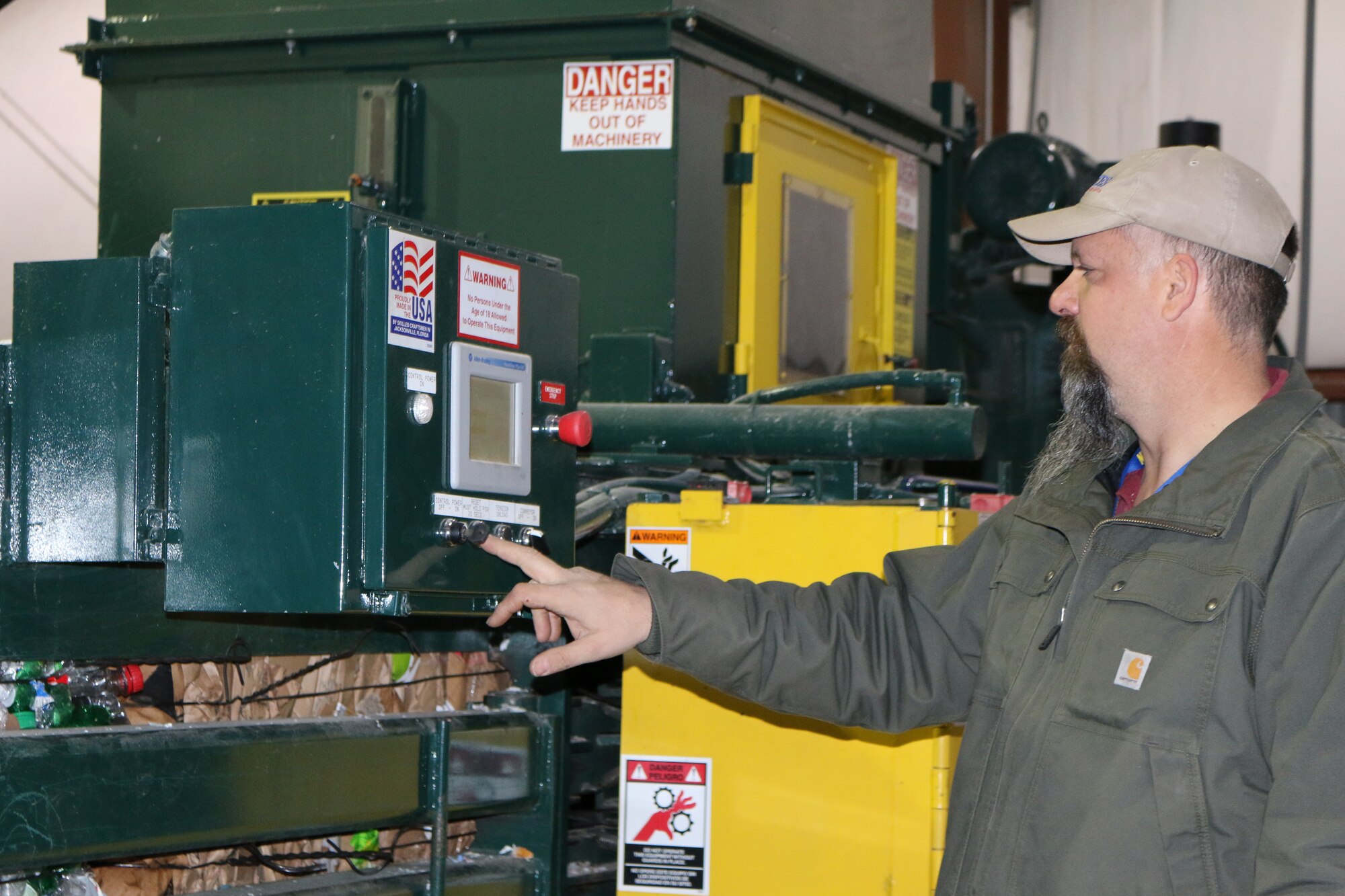 Jerry Rice, manager of the AEDC Recycling Center, starts the baler used for condensing the recyclables collected on base. Through the recycling program at AEDC, 68 tons of cardboard, 25 tons of mixed paper, approximately 20 tons of plastics, types 1 and 2, and 1000 pounds of toner cartridges were collected during Fiscal Year 2015. In an effort to meet the Department of Defense Strategic Sustainability Performance Plan goal of diverting 55 percent of non-hazardous solid waste and 100 percent of electronics waste, Recycling Center staff encourages all AEDC employees to recycle. (U.S. Air Force photo/Deidre Ortiz)