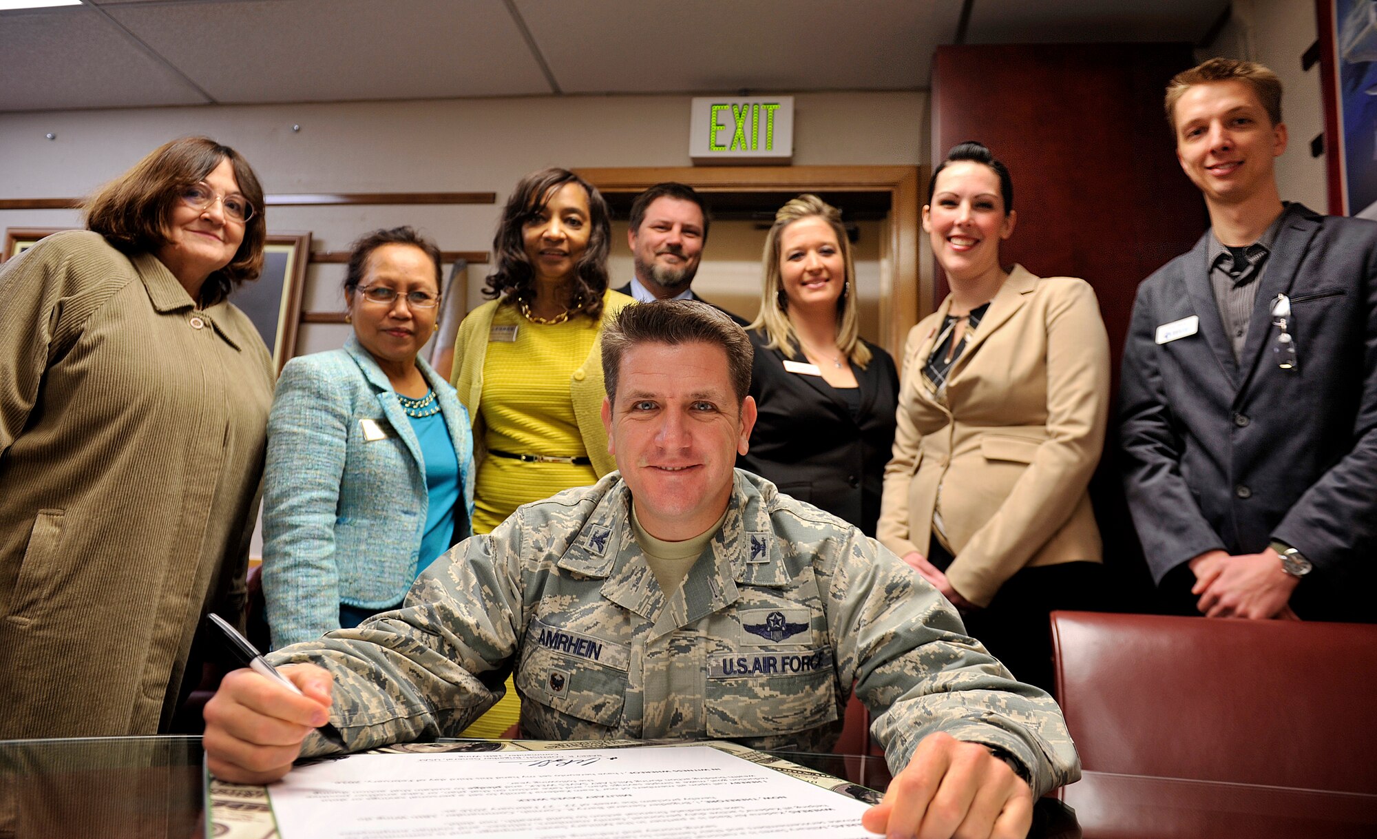 U.S. Air Force Col. Christopher Amrhein, 18th Wing vice commander, signs the Military Saves Week proclamation at the 18th Wing headquarters building, Feb. 9, 2016, at Kadena Air Base, Japan. Military Saves Week is scheduled to run from Feb. 22-27, and this year’s theme is Set a Goal, Make a Plan, and Save Automatically. The campaign is designed to persuade, motivate and encourage military families to save money every month, and to convince leaders and organizations to be aggressive in promoting automatic savings. (U.S. Air Force photo by Naoto Anazawa)