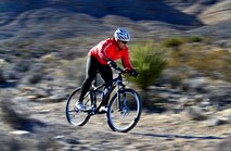 A U.S. veteran participating in the Ride 2 Recovery program rides his bike Feb. 2, 2016, at Blue Diamond, Nevada. The program reaches out to veterans through cycling as a therapy for injuries, Post-Traumatic Stress Disorder, Traumatic Brain Injuries and creates a family for them to be a part of again. (U.S. Air Force photo by Senior Airman Christian Clausen/Released)
