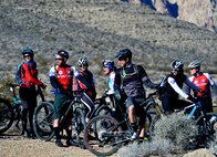 U.S. veterans participating in the Ride 2 Recovery program enjoy a laugh before starting a mountain bike ride Feb. 2, 2016, at Blue Diamond, Nevada. The program is dedicated to helping wounded and recovering veterans recover from injuries sustained during their military service through biking. (U.S. Air Force photo by Senior Airman Christian Clausen/Released)