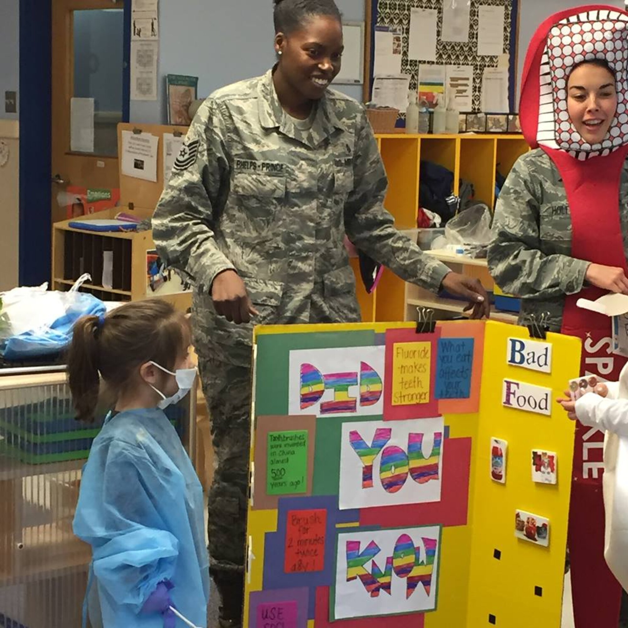 On Feb. 5, members of the Dental Squadron from the 779th Medical Group went to the Child Development Center on Joint Base Andrews to teach the kids about good dental health. They played a game to match good foods versus bad foods. (AF photo by Melanie Moore/Released)

