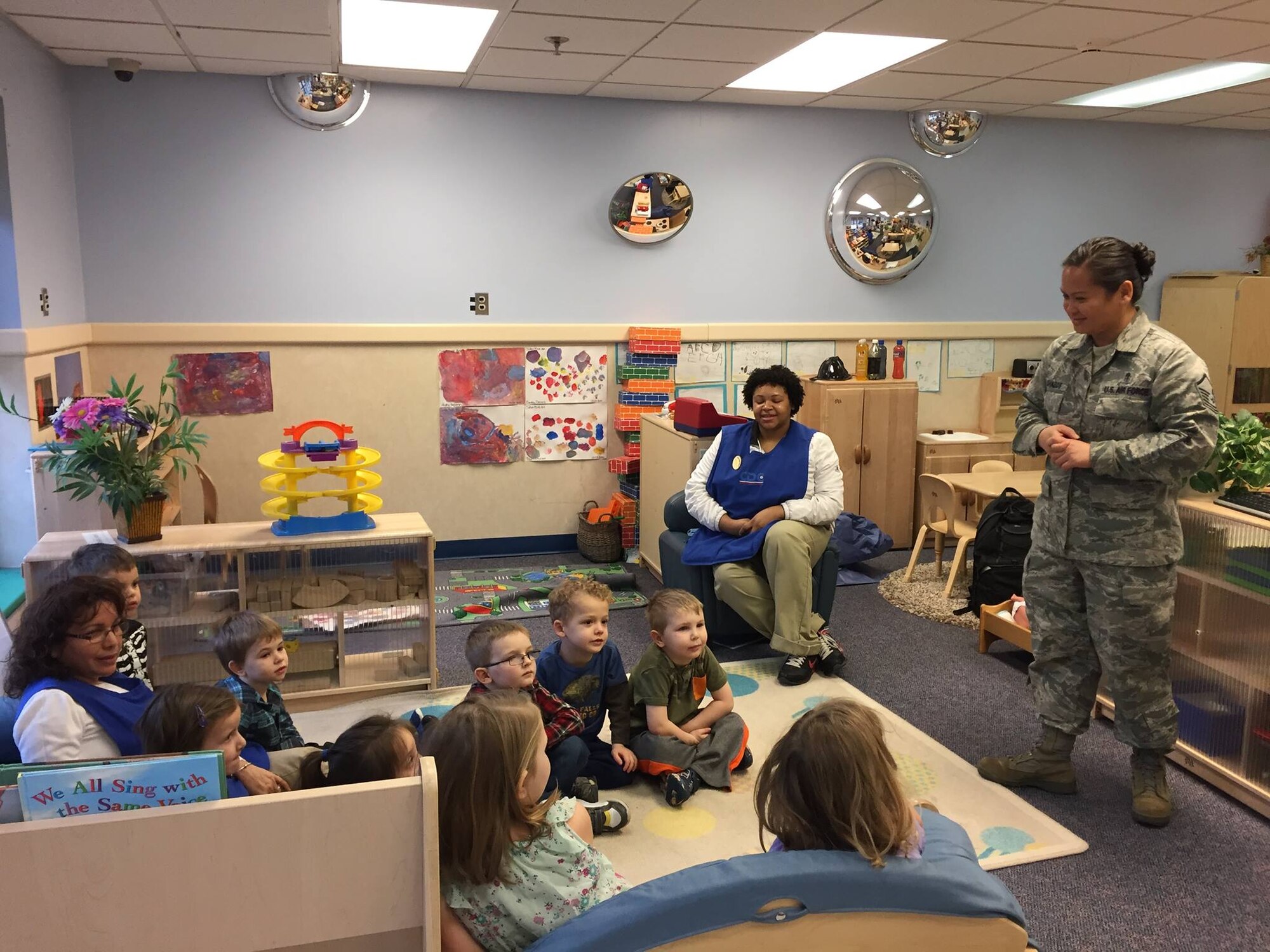 On Feb. 5, members of the Dental Squadron from the 779th Medical Group went to the Child Development Center on Joint Base Andrews to teach the kids about good dental health. Master Sgt. Millicent Cavazos, dental hygienist , talked to the children and answered their questions about brushing, flossing, rinsing, and eating healthy snacks. (AF photo by Melanie Moore/Released)

