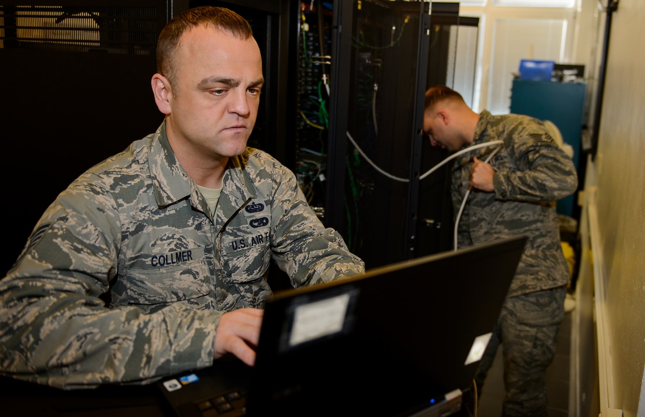 Tech. Sgt. Randal Collmer, 1st Communications Maintenance Squadron infrastructure theater maintenance section chief, and Staff Sgt. Bradley Anderson, 1st CMXS special communications maintenance technician, work to test their training network at Kapaun Military Complex, Germany, Jan. 8, 2016. The 1st CMXS supports bases around Europe by working side by side to improve and optimize the bases networks. Currently they are strengthening Ramstein Air Base, Germany, cyber networks. (U.S. Air Force photo/Staff Sgt. Armando A. Schwier-Morales)