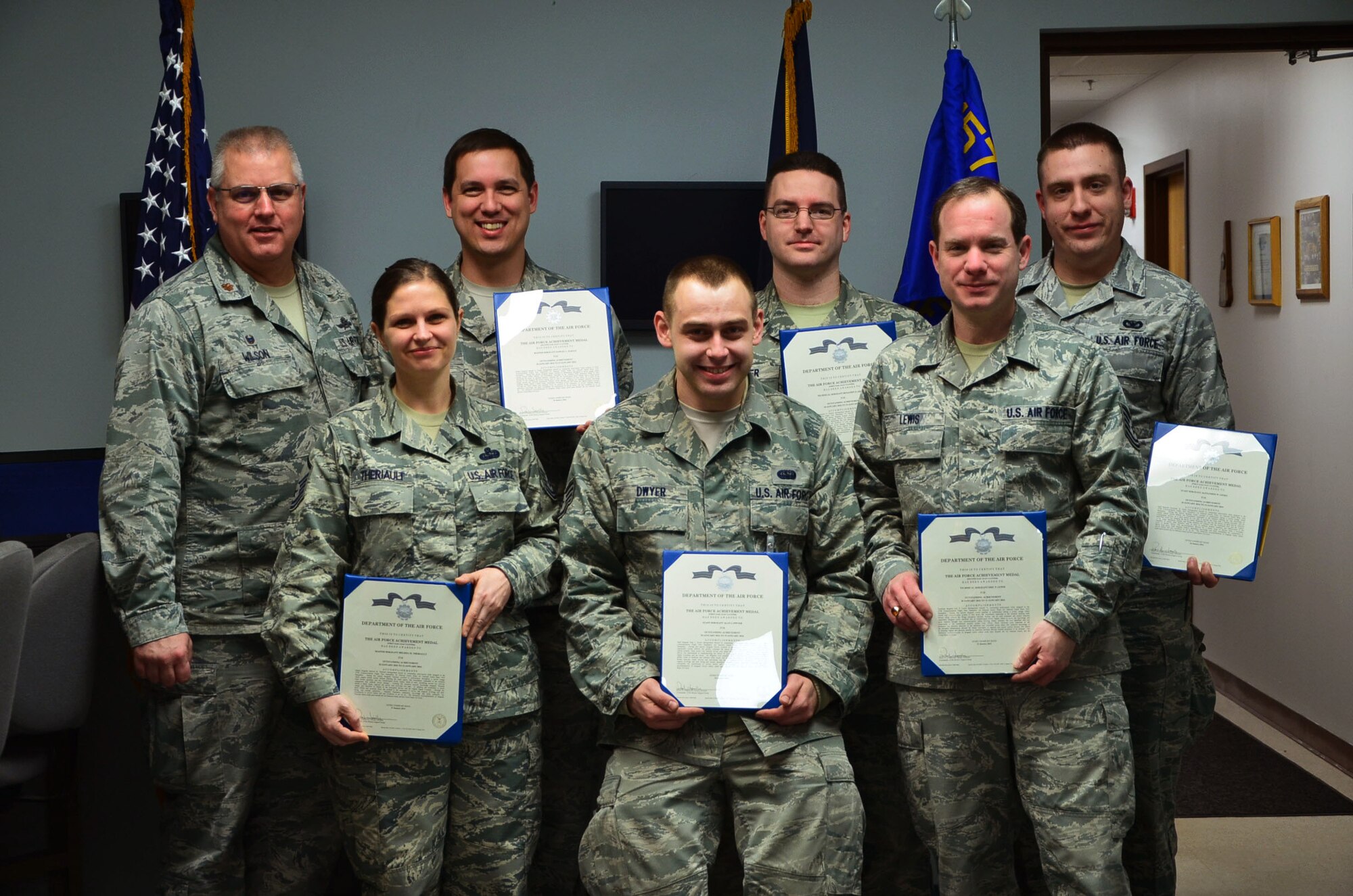 Six Airmen from the 157th Communications Flight were presented with achievement medals for their performance during a power outage experienced during the January unit training assembly, Pease Air National Guard Base, N.H. (U.S. Air National Guard photo by Senior Airman Kayla McWalter)