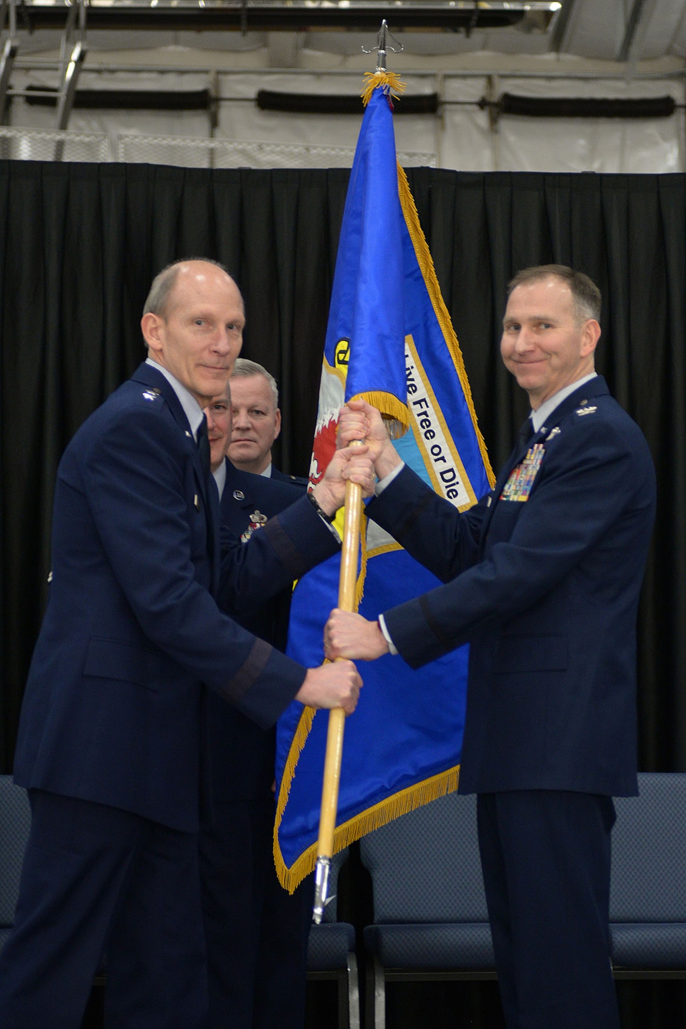 The New Hampshire Adjutant General Maj. Gen. William N. Reddel III passes
the wing colors to Col. James Ryan during a change of command ceremony, Feb.
7, 2016, Pease Air National Guard Base, New Hampshire. The event was
attended by the Governor of New Hampshire the Honorable Maggie Hassan, and
Airmen both past and present. This ceremony signified command of the 157th
Air Refueling Wing changing from Col. Shawn R. Burrus to Ryan. (U.S. Air
National Guard photo by Airman 1st Class Ashlyn J. Correia)

