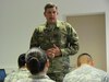 Chief Warrant Officer 5 Russell Smith, the Army Reserve Command Chief Warrant Officer speaks during a town hall meeting with about two dozen Soldiers Sunday, February 7, 2016 at the 7th MSC headquarters building in Kaiserslautern, Germany. (Photo by Lt. Col. Jefferson Wolfe)
