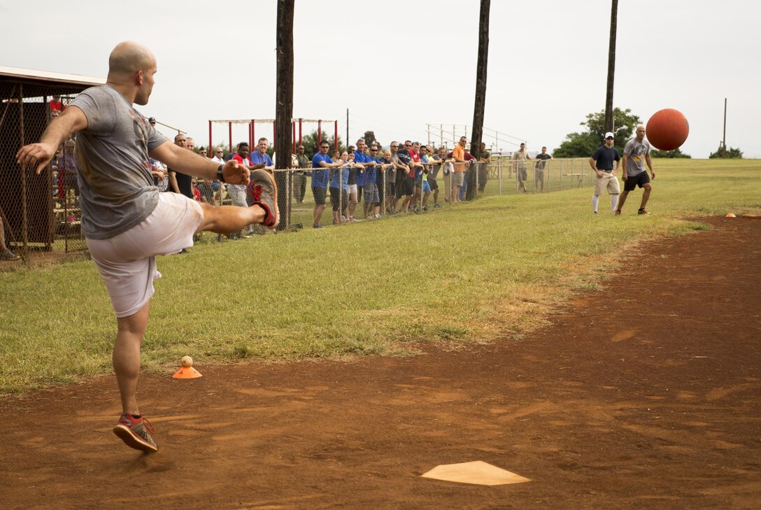 Marines of U.S. Marine Corps Forces, Pacific participate in a kickball game on Bordelon Field aboard Camp H. M. Smith, Hawaii, Feb. 5, 2016. Officers and staff noncommissioned officers faced off in a team-building event held quarterly to compete, build camaraderie and increase Esprit de Corps. 