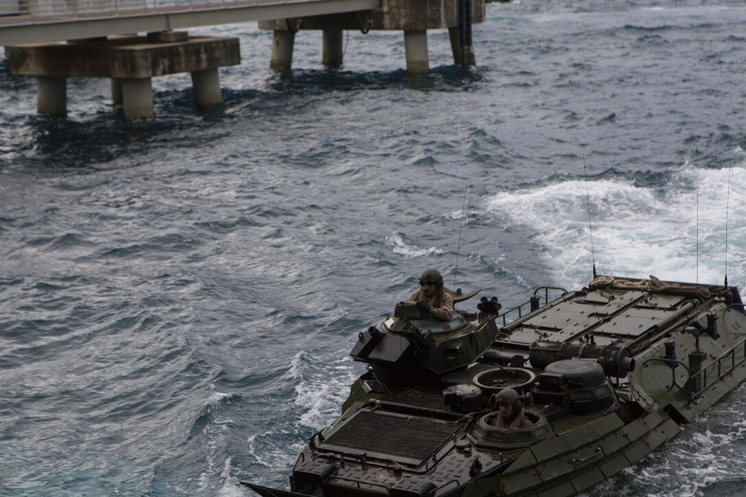 Marines with Alpha Company, Battalion Landing Team 1st Battalion, 5th Marines, 31st Marine Expeditionary Unit, drive their AAV-P7/A1 Amphibious Assault Vehicle toward the well-deck of the USS Ashland (LSD 48) Jan. 29, 2016, at White Beach, Okinawa, Japan. The Marines loaded their AAVs onto the Ashland before departing for the MEU's spring deployment. The spring deployment is a regularly scheduled deployment designed to support PACOM's theater security cooperation initiatives to promote goodwill, and strengthen allied relationships. 