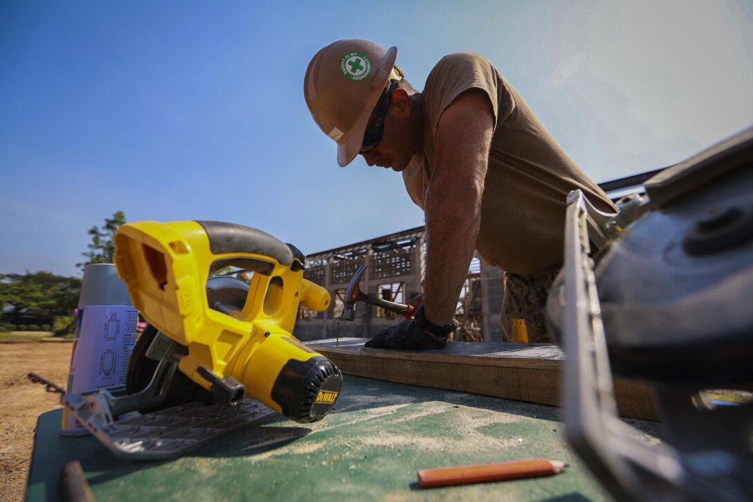 U.S. Navy Petty Officer 1st Class Antonio Gonzalez, builder, with Naval Mobile Construction Battalion 3, helps with the construction of a community center at the Ban Sa Yai School, in Trat, Thailand, during exercise Cobra Gold, Feb. 3, 2016. Cobra Gold 2016, in its 35th iteration, includes a specific focus on humanitarian civic action, community engagement, and medical activities conducted during the exercise to support the needs and humanitarian interests of civilian populations around the region. 