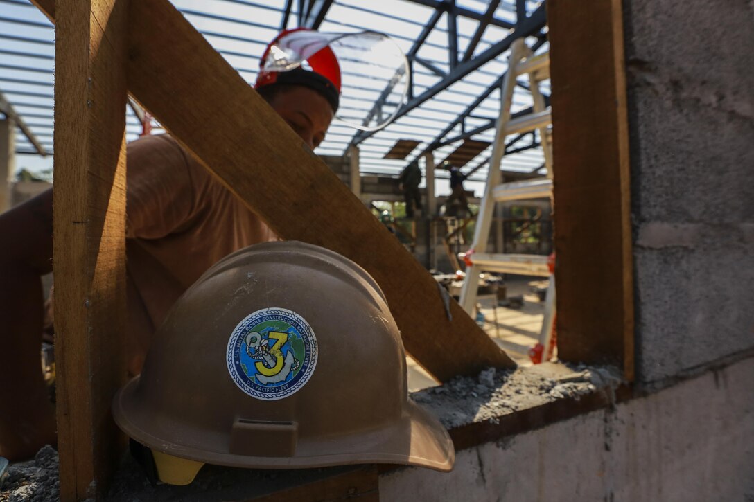 Service members from the Royal Thai Armed Forces, Malaysia Armed Forces and the U.S. Navy, Naval Mobile Construction Battalion 3, work together to build a community center at the Ban Sa Yai School, in Trat, Thailand, during exercise Cobra Gold, Feb. 3, 2016. Cobra Gold 2016, in its 35th iteration, includes a specific focus on humanitarian civic action, community engagement, and medical activities conducted during the exercise to support the needs and humanitarian interests of civilian populations around the region.