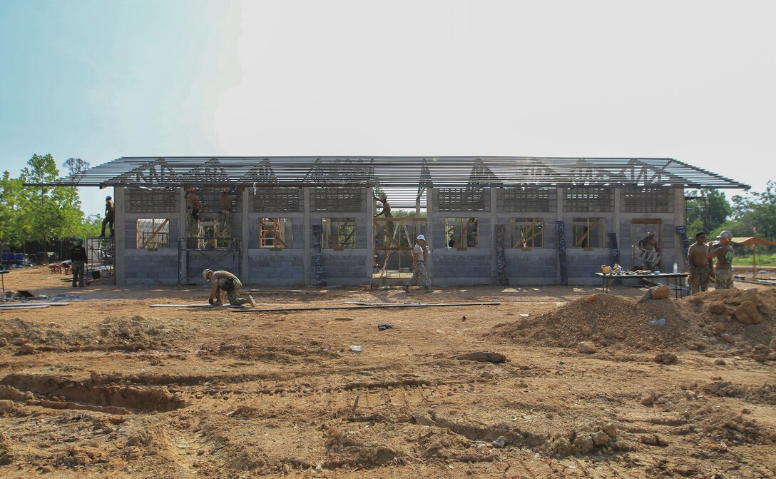 Service members from the Royal Thai Armed Forces, Malaysia Armed Forces and the U.S. Navy work together to build a community center at Ban Sa Yai School, in Trat, Thailand, during exercise Cobra Gold, Feb. 3, 2016. Cobra Gold 2016, in its 35th iteration, includes a specific focus on humanitarian civic action, community engagement and medical activities conducted during the exercise to support the needs and humanitarian interests of civilian populations around the region.