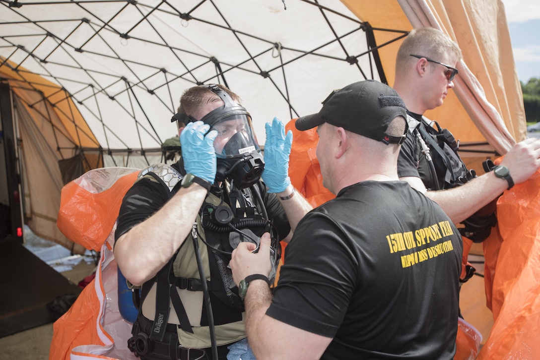 Army Sgt. Darwin Jurentkuff, left, prepares to enter the simulated hazardous area during proficiency training at the Roberto Clemente Stadium in Carolina, Puerto Rico, Jan. 26, 2016. Jurentkuff is a survey team member assigned to the Vermont National Guard’s 15th Civil Support Team. Vermont Army National Guard photo by Staff Sgt. Nathan Rivard