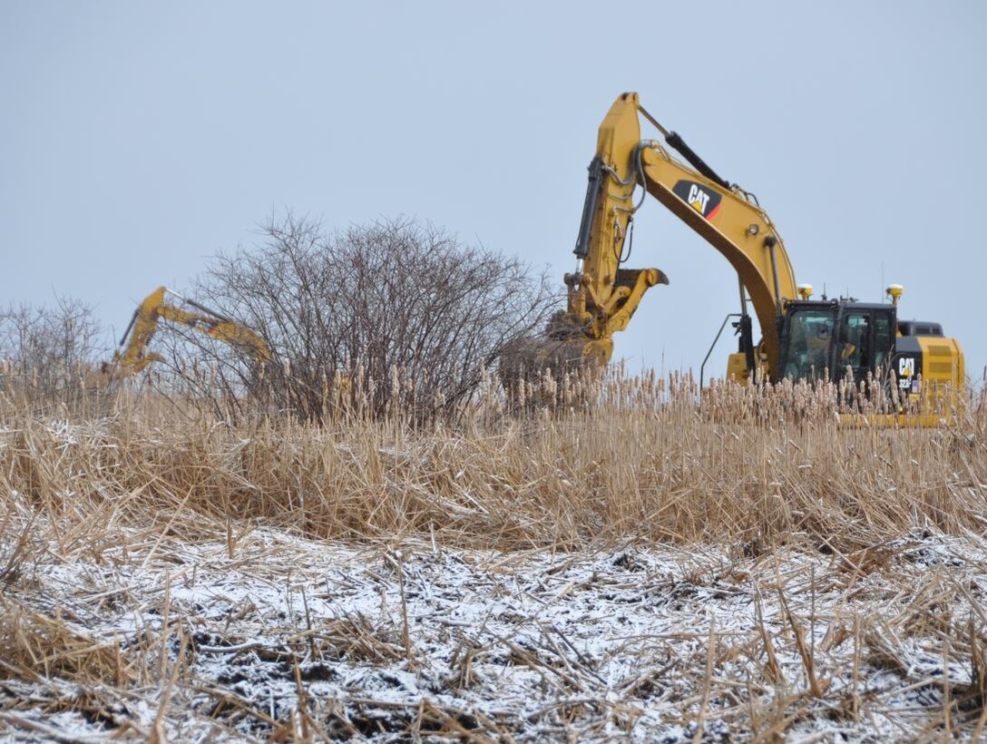 Excavators creating channels and potholes in the Braddock Bay Wildlife Management Area, Greece, NY
