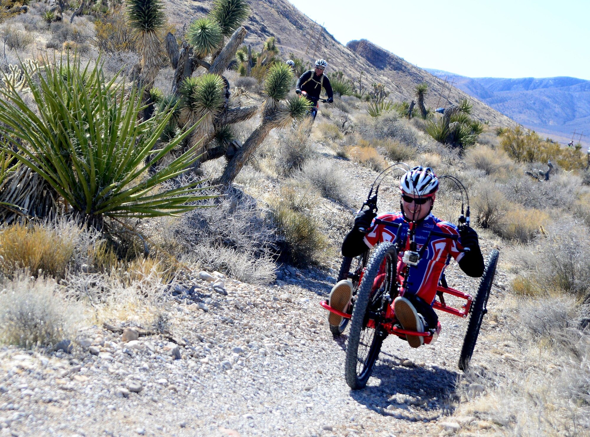 A recovering U.S. veteran rides his custom mountain bike as part of a Ride 2 Recovery program event Feb. 2, 2016, at Blue Diamond, Nev. The program is dedicated to helping wounded and recovering veterans by bringing the veterans together to lift their spirits and even provide custom made bikes for the disabled free of charge. (U.S. Air Force photo/Senior Airman Christian Clausen)