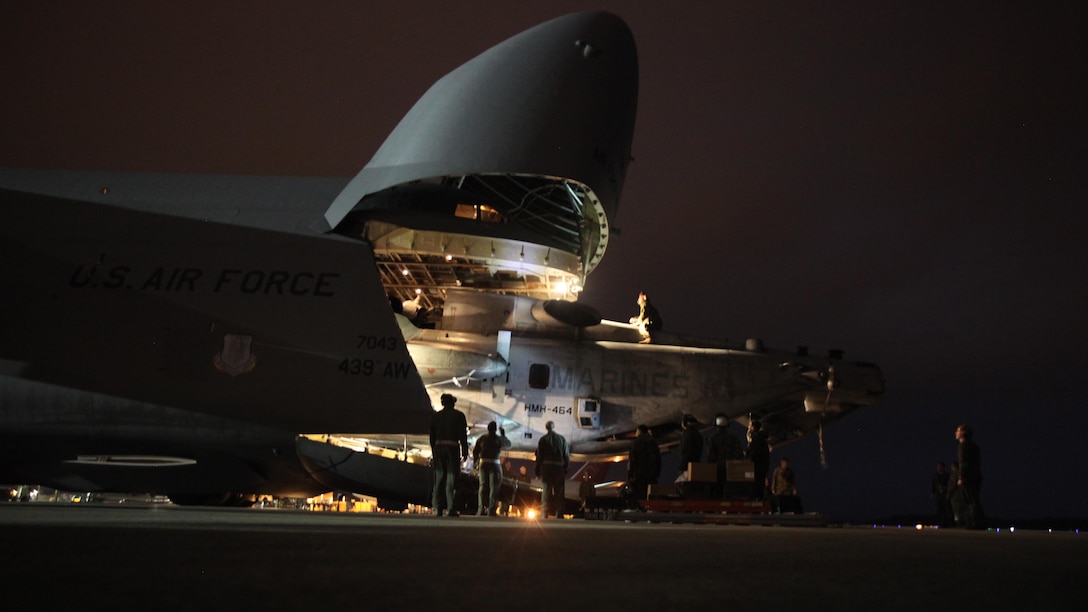 Marines with Marine Heavy Helicopter Squadron 464 load a CH-53E Super Stallion onto a C-5 Galaxy in preparation for Operation Cold Response 2016 at Marine Corps Air Station Cherry Point, North Carolina, Feb. 3, 2016. The key purpose of Cold Response is to train and educate participants on how to conduct combat operations in a cold weather environment. Up to 2,000 Marines and 15,000 military personnel from 14 nations will attend the North Atlantic Treaty Organization-level exercise.
