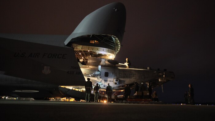 Marines with Marine Heavy Helicopter Squadron 464 load a CH-53E Super Stallion onto a C-5 Galaxy in preparation for Operation Cold Response 2016 at Marine Corps Air Station Cherry Point, North Carolina, Feb. 3, 2016. The key purpose of Cold Response is to train and educate participants on how to conduct combat operations in a cold weather environment. Up to 2,000 Marines and 15,000 military personnel from 14 nations will attend the North Atlantic Treaty Organization-level exercise.