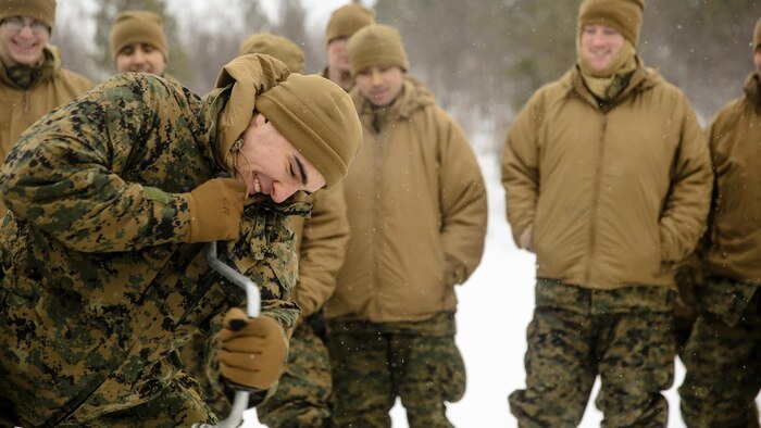 1st Lt. Nicholas Patistas, the adjutant with Black Sea Rotational Force, attempts to break the ice cold-weather training at Skoganvarre, Norway, Feb. 5, 2016. The Arctic training was conducted by the U.K. Royal Commandos and hosted by the Norwegian military to improve the U.S. Marine Corps’ capability to support their NATO Allies in extreme environments.