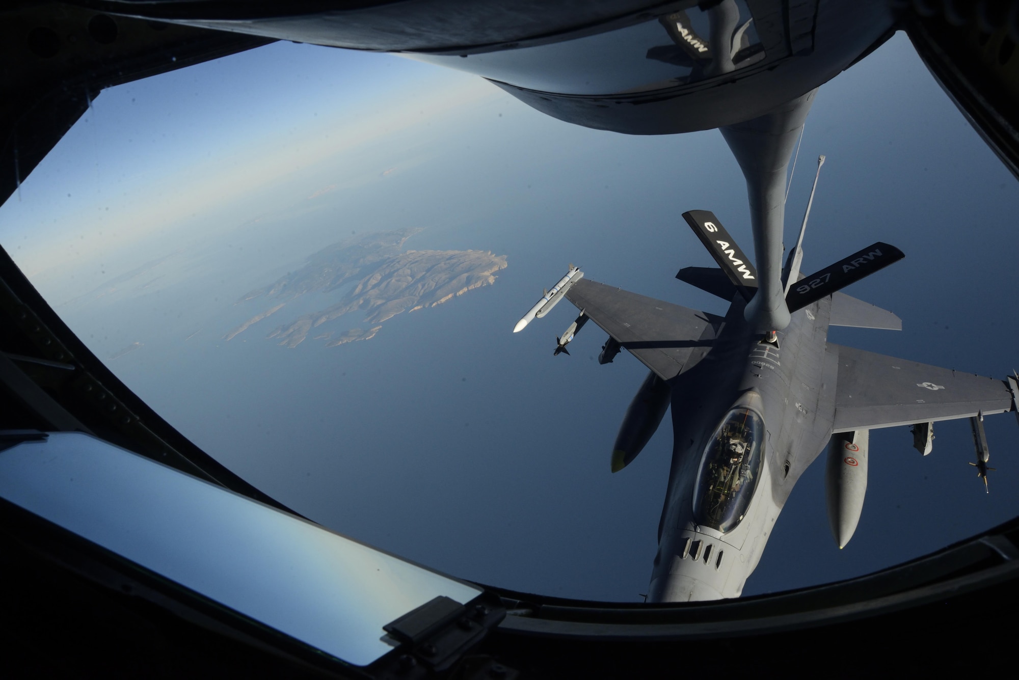 A KC-135 Stratotanker, assigned to the 63rd Air Refueling Squadron at MacDill Air Force Base, Fla., refuels an F-16 Fighting Falcon, assigned to the 480th Expeditionary Fighter Squadron at Spangdahlem Air Base, Germany, during a flying training deployment at Souda Bay, Greece, Feb. 2, 2016. The 63rd ARS operated out of Souda Bay Naval Air Station for the duration of the flying training deployment. (U.S. Air Force photo/Staff Sgt. Christopher Ruano)