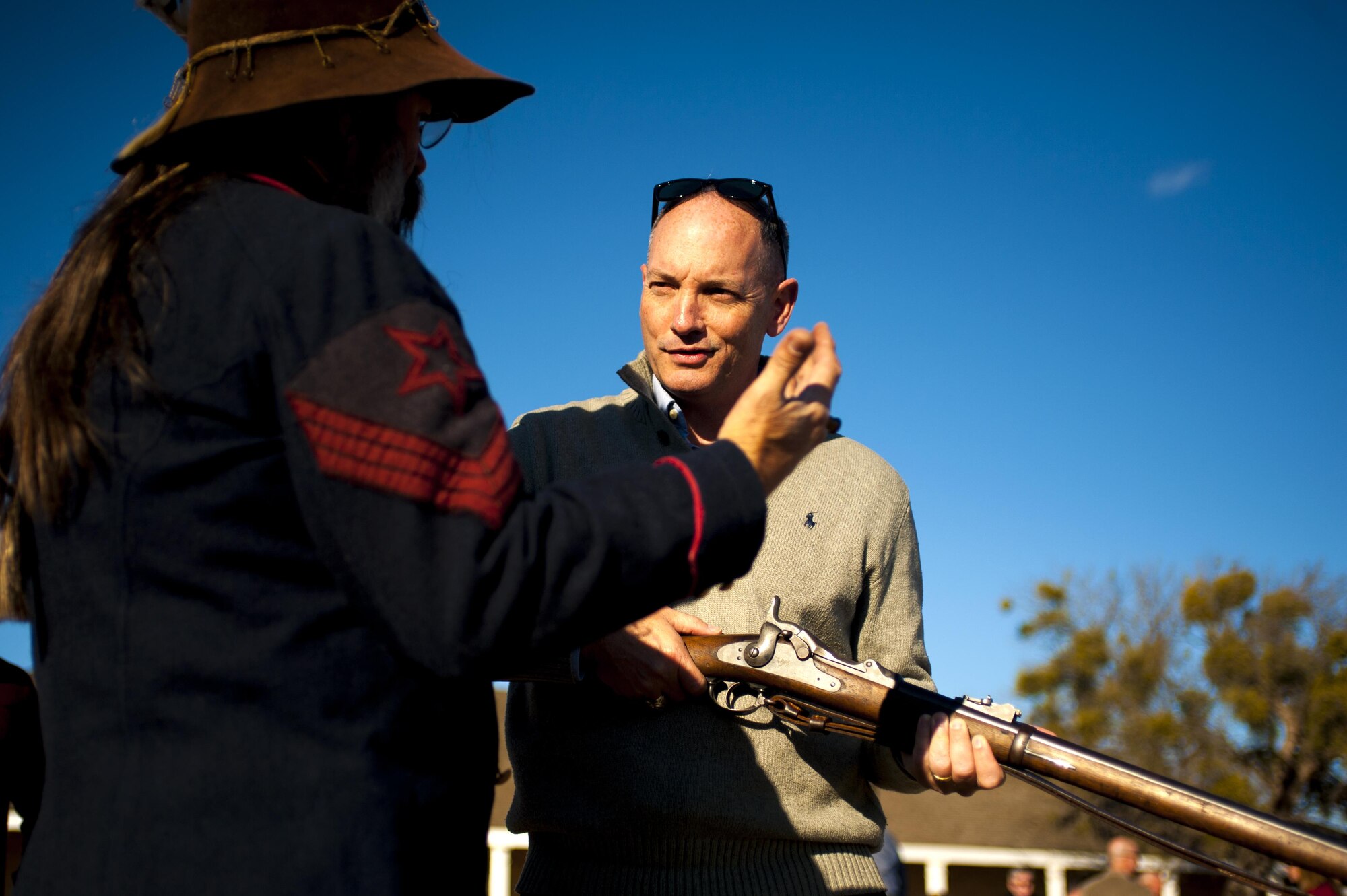 U.S. Air Force Col. Michael L. Downs, 17th Training Wing Commander, receives instruction on handling a historic rifle at Fort Concho national historic landmark in San Angelo, Texas, Feb. 3, 2016. Downs and other base leadership visited Fort Concho during a three-day commander’s conference, which focused on mentorship. (U.S. Air Force photo by Senior Airman Scott Jackson/Released)