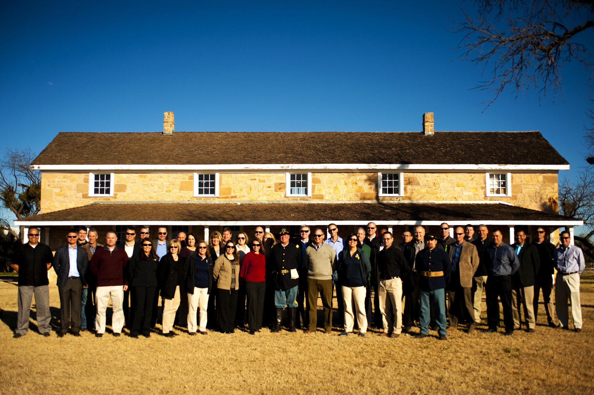 Goodfellow Air Force Base leadership pose in front of the Fort Concho headquarters building during a tour in San Angelo, Texas, Feb. 3, 2016. The tour was in conjunction with a commander’s conference hosted by U.S. Air Force Col. Michael L. Downs, 17th Training Wing Commander, bringing together base leaders to talk on leadership and the challenges it can bring. (U.S. Air Force photo by Senior Airman Scott Jackson/Released) 