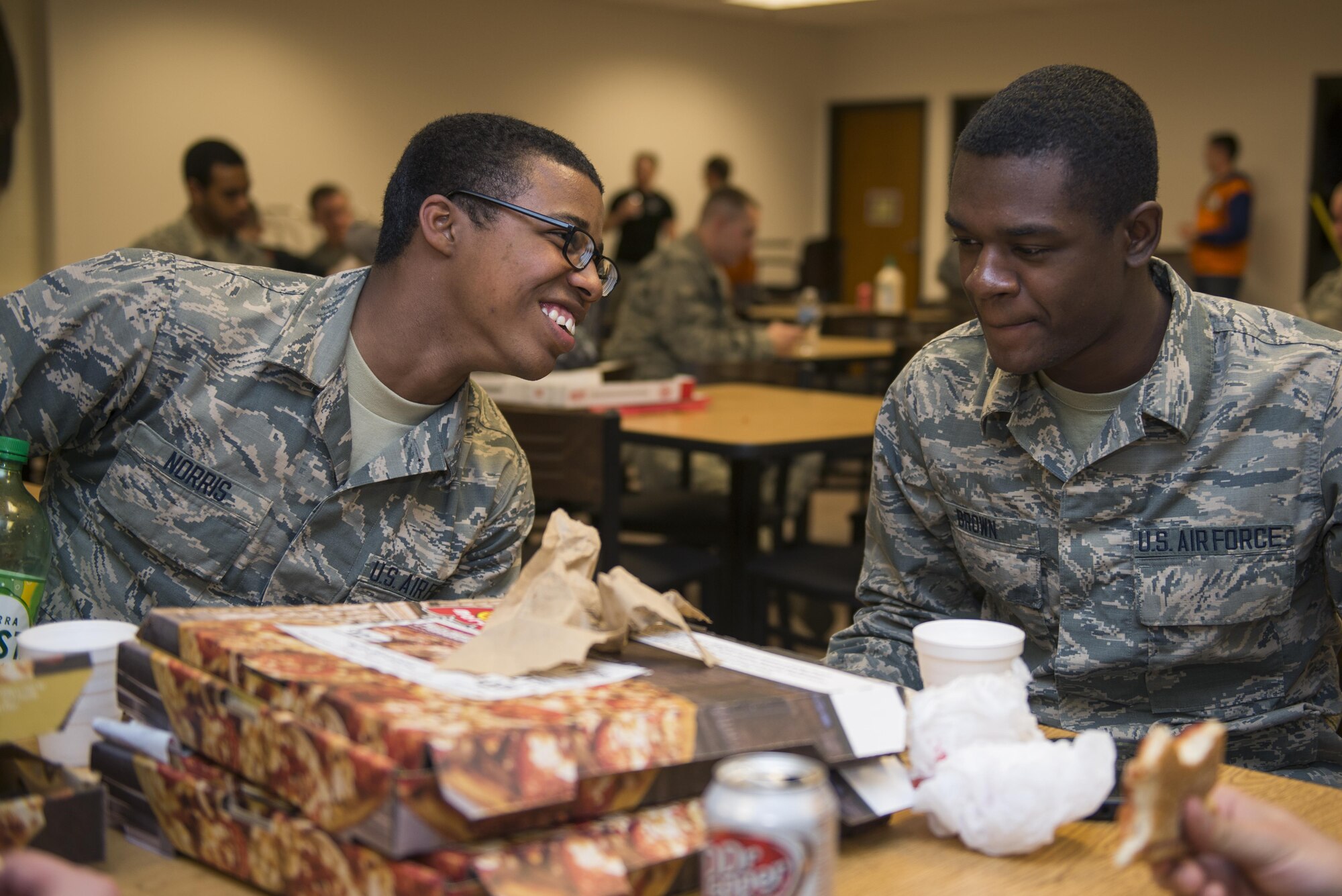 Airman Alijah Norris (left) and Airman Alante Brown (right), 366th Training Squadron students, attend a Super Bowl party at the Sheppard Air Force Base, Texas, Solid Rock Cafe. The Chapel staff served more than 400 people on Super Bowl Sunday, investing nearly $800 in their spiritual health, morale and well-being, Feb. 7, 2016. Sheppard chaplains also serve nearly 180,000 visitors annually, with the largest Airman Ministry Center in the Air Force. (U.S. Air Force photo/Senior Airman Kyle Gese)