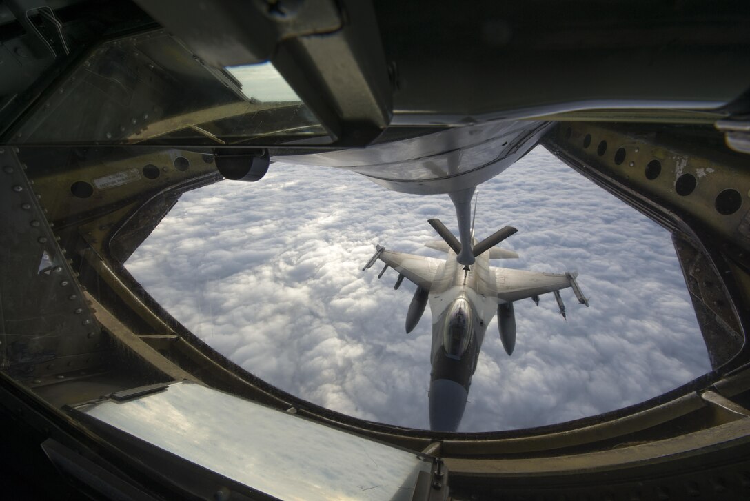 An F-16 Fighting Falcon aircraft links up with a KC-135 Stratotanker for refueling in support of Forceful Tiger near Okinawa, Japan, Jan. 28, 2016. The pilot is assigned to the 18th Aggressor Squadron at Eielson Air Force Base, Alaska. Air Force photo by Staff Sgt. Maeson L. Elleman