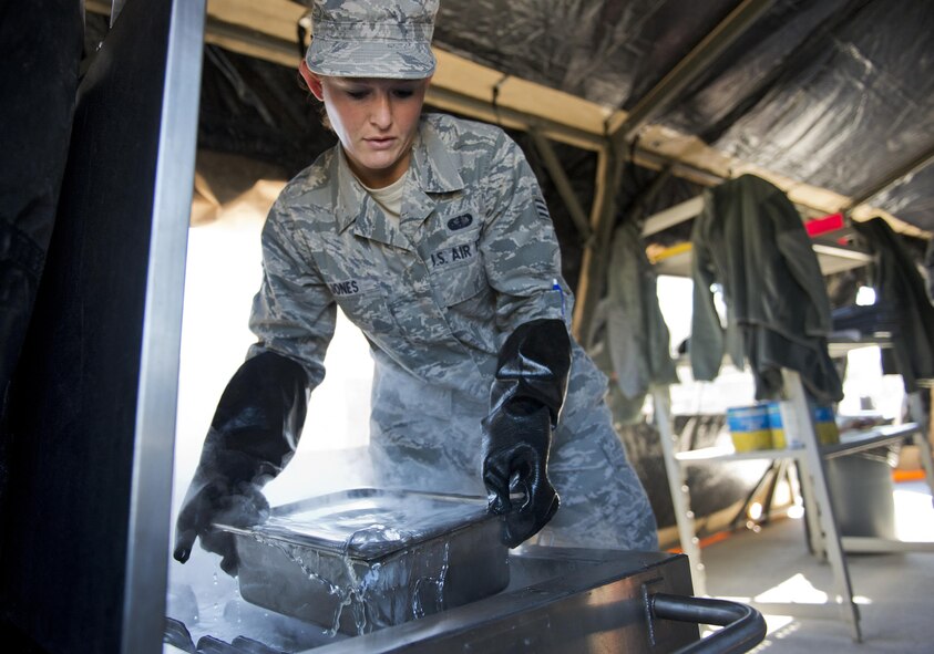 Senior Airman Haylee Jones, 919th Special Operations Force Support Squadron, places a pan into the freezer in the unit’s field kitchen Feb. 7 at Duke Field Fla.  The kitchen was erected and used as part of the 919th SOFSS flight’s Hennessy Award inspection.  The Airmen cooked and served lunch to customers from the constructed kitchen.  (U.S. Air Force photo/Tech. Sgt. Jasmin Taylor)