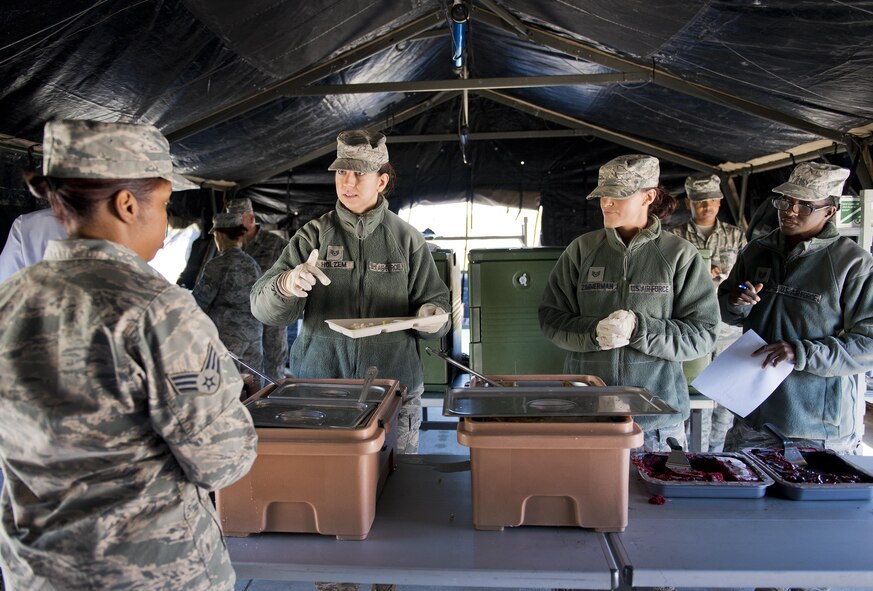 Staff Sgt. Molly Holzem, 919th Special Operations Force Support Squadron, prepares a plate for a customer in the unit’s field kitchen Feb. 7 at Duke Field Fla.  The kitchen was erected and used as part of the 919th SOFSS flight’s Hennessy Award inspection.  The Airmen cooked and served lunch to customers from the constructed kitchen.  (U.S. Air Force photo/Tech. Sgt. Jasmin Taylor)
