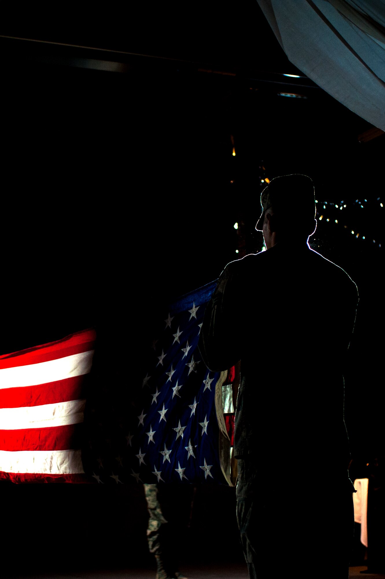 An Airman folds the American flag at the Fort Concho stables, San Angelo, Texas, Feb. 5, 2016. The flag folding ceremony concluded the 17th Training Wing Annual Awards. (U.S. Air Force photo by Senior Airman Scott Jackson/Released)