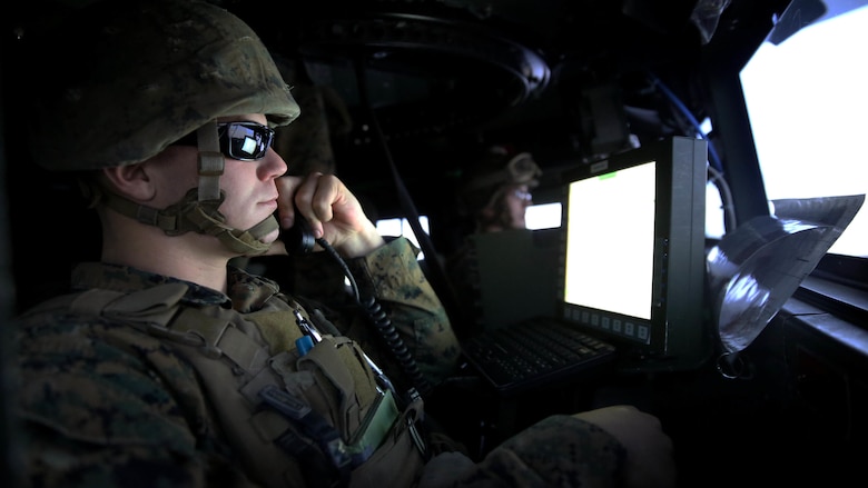 A Marine with 5th Battalion, 11th Marine Regiment, 1st Marine Division, establishes communications with the combat operation center in a Combat Convoy Simulator at Marine Corps Base Camp Pendleton, California, Feb. 2, 2016. The CCS at first glance looks like an expensive, high-tech video game, but its primary use is preparing Marines for real-world combat missions with simulations of realistic scenarios.