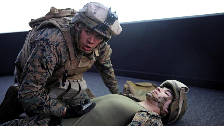 Marines with 5th Battalion, 11th Marine Regiment, 1st Marine Division, rehearse procedures for assessing and treating combat injuries in a Combat Convoy Simulator at Marine Corps Base Camp Pendleton, California, Feb. 2, 2016. The CCS at first glance looks like an expensive, high-tech video game, but its primary use is preparing Marines for real-world combat missions with simulations of realistic scenarios.