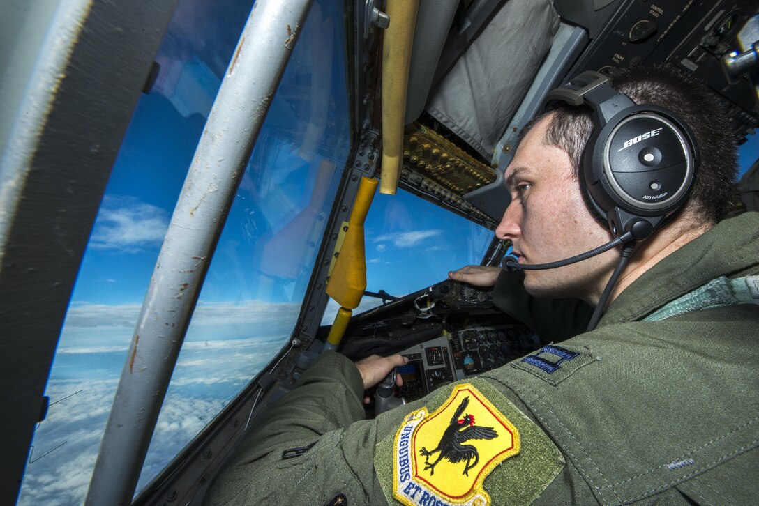 Air Force Capt. Christopher Thompson flies his KC-135 Stratotanker and scans the horizon for other aircraft during Forceful Tiger near Okinawa, Japan, Jan. 28, 2016. Thompson is a pilot assigned to the 909th Air Refueling Squadron. Air Force photo by Staff Sgt. Maeson L. Elleman