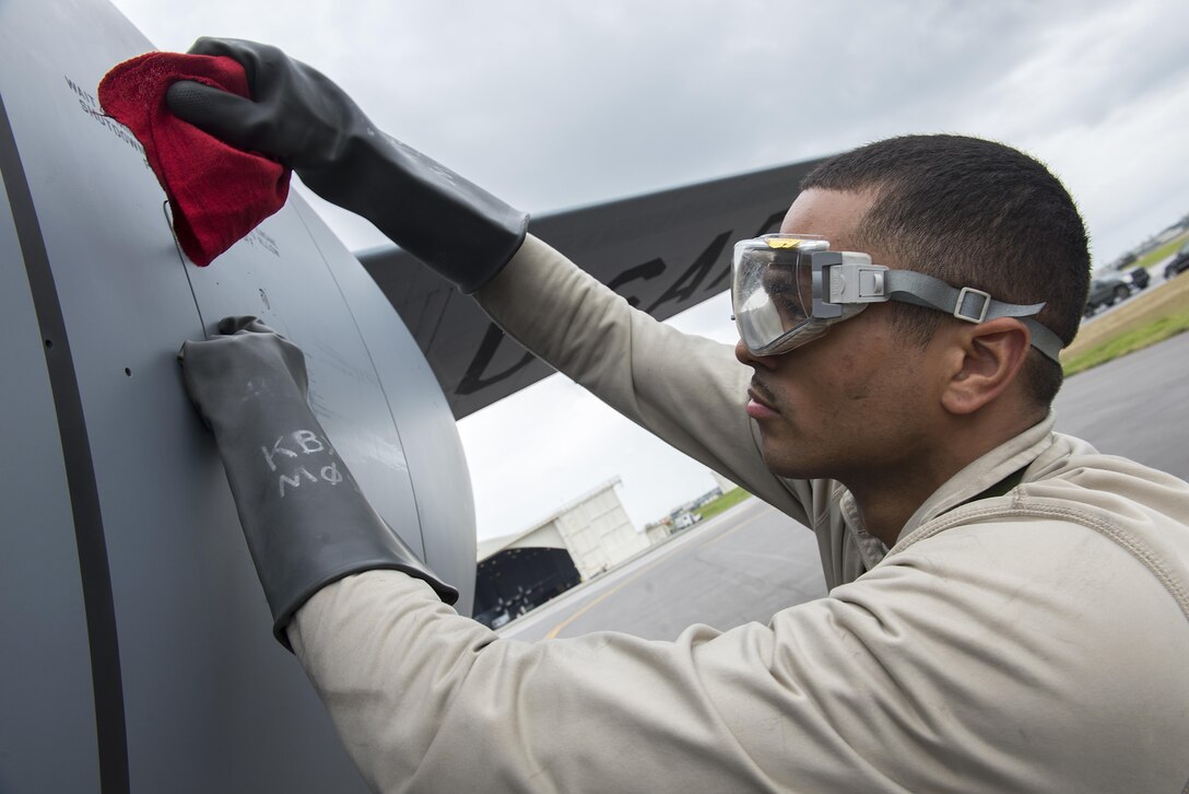 Air Force Senior Airman Michael Lawrence checks the engine oil on a KC-135 Stratotanker following a flight in support of Forceful Tiger on Kadena Air Base, Japan, Jan. 28, 2016. Lawrence is a crew chief assigned to the 909th Aircraft Maintenance Unit. Air Force photo by Staff Sgt. Maeson L. Elleman