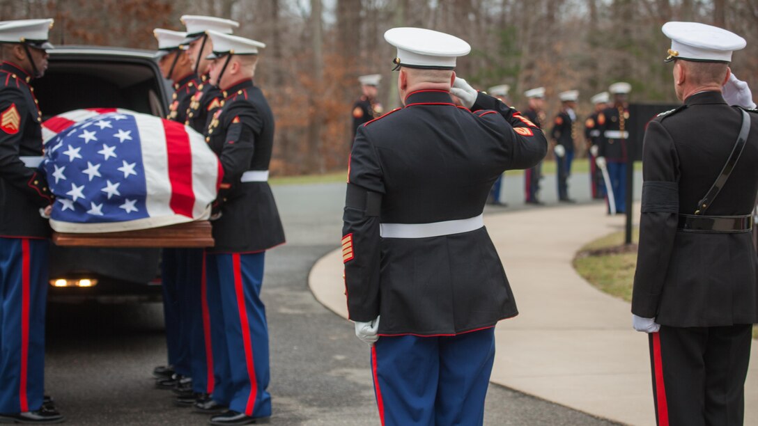Lieutenant Gen. Jon M. Davis, right, salutes the casket of Lt. Gen. William H. Fitch (ret.) at Quantico National Cemetery, Feb. 4, 2016, in Triangle, Virginia. Fitch died Jan. 19, 2016. He served as the Deputy Commandant for Aviation before he retired in 1984 after 32 years as a Marine Corps officer. 