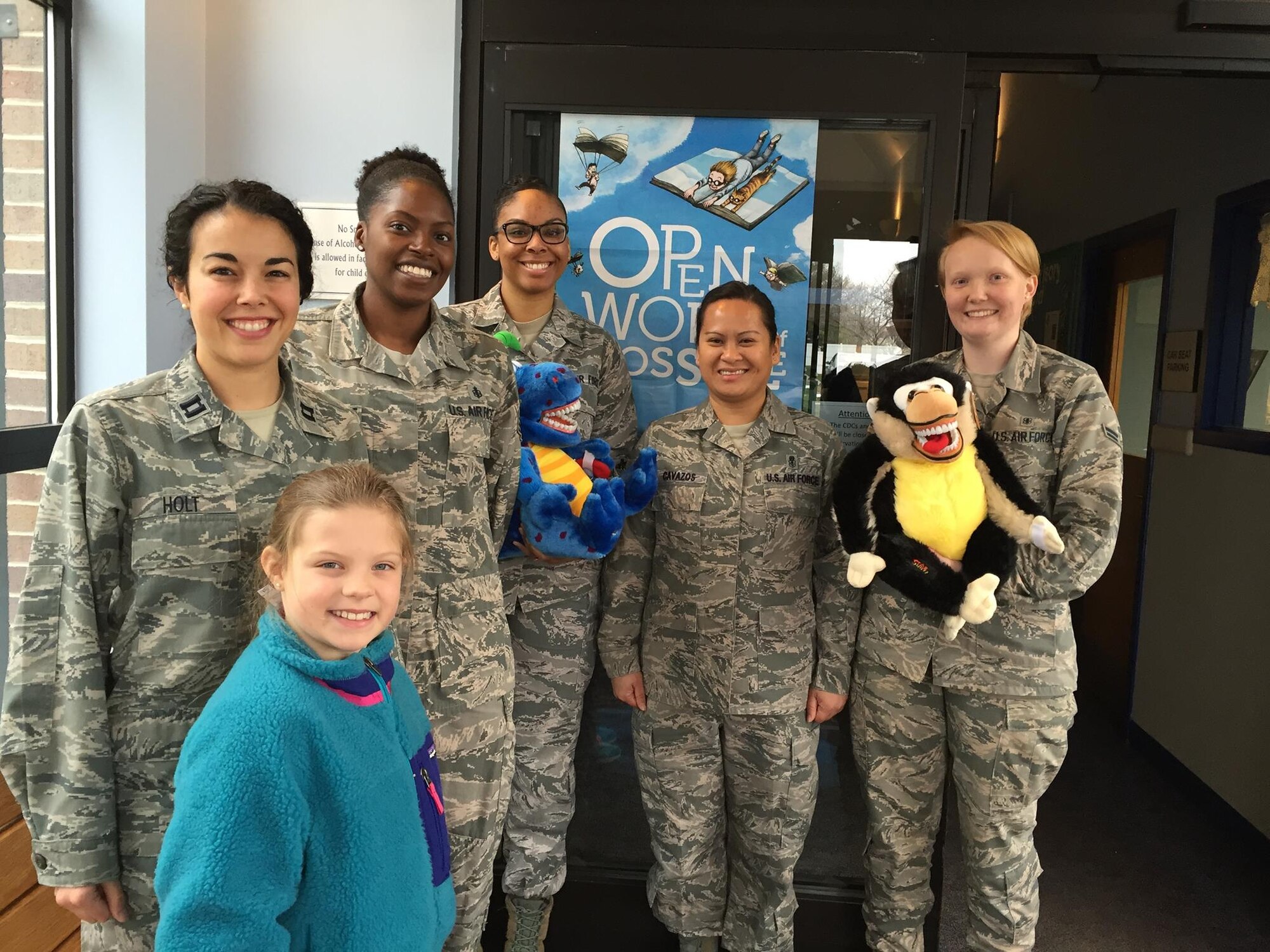 On Feb. 5, members of the Dental Squadron from the 779th Medical Group went to the Child Development Center on Joint Base Andrews to teach the kids about good dental health. From left to right are: Captain (Dr.) Melissa Holt, Air Force dentist and her daughter Samantha; Tech. Sgt. Tina Phelps-Prince, NCOIC for preventive dentistry; Senior Airman Kira Davis, dental technician; Master Sgt. Millicent Cavazos, dental hygienist; and Airman 1st Class Elizabeth Smith, dental assistant. (AF photo by Melanie Moore/Released) 