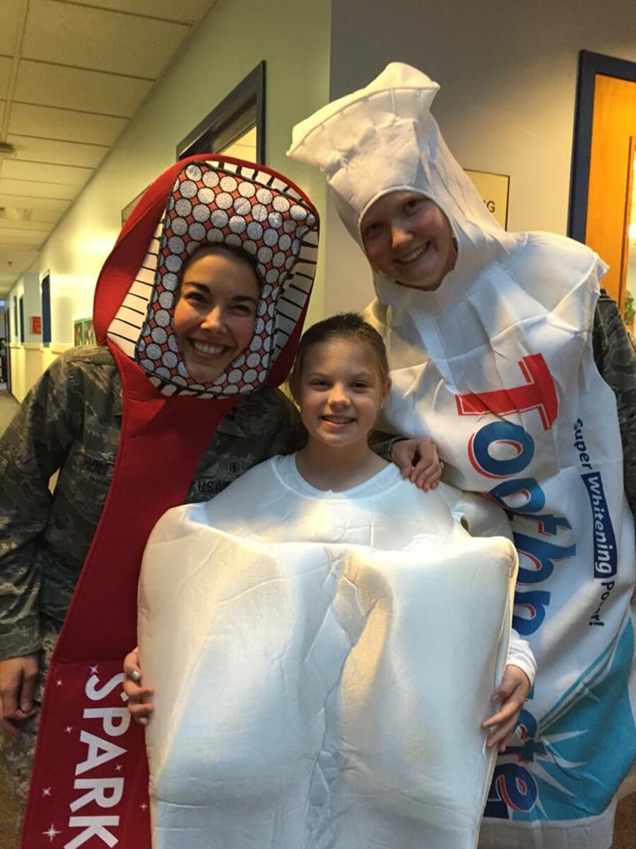 On Feb. 5, members of the Dental Squadron from the 779th Medical Group went to the Child Development Center on Joint Base Andrews to teach the kids about good dental health. Captain (Dr.) Melissa Holt, an Air Force dentist was the toothbrush; her daughter Samantha was the tooth; and Airman 1st Class Elizabeth Smith, a dental assistant, was the toothpaste. (AF photo by Melanie Moore/Released) 